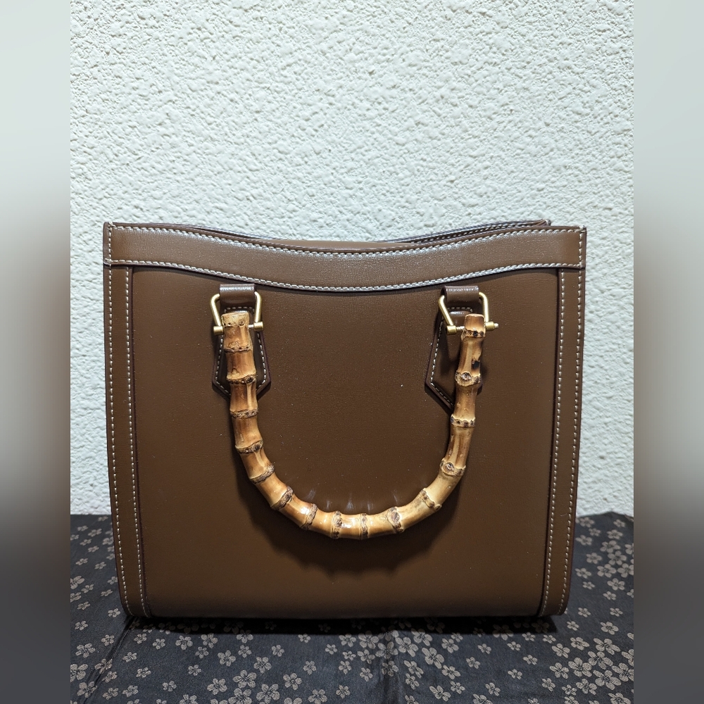 Brown Leather tote bag with bamboo handles and extra strap
